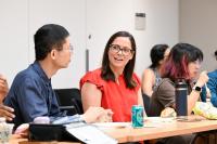 Attendees talk during a SHARP training during a break